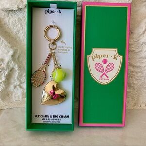 NWT Piper K tennis bag charm featuring large gold toned metal heart locket
